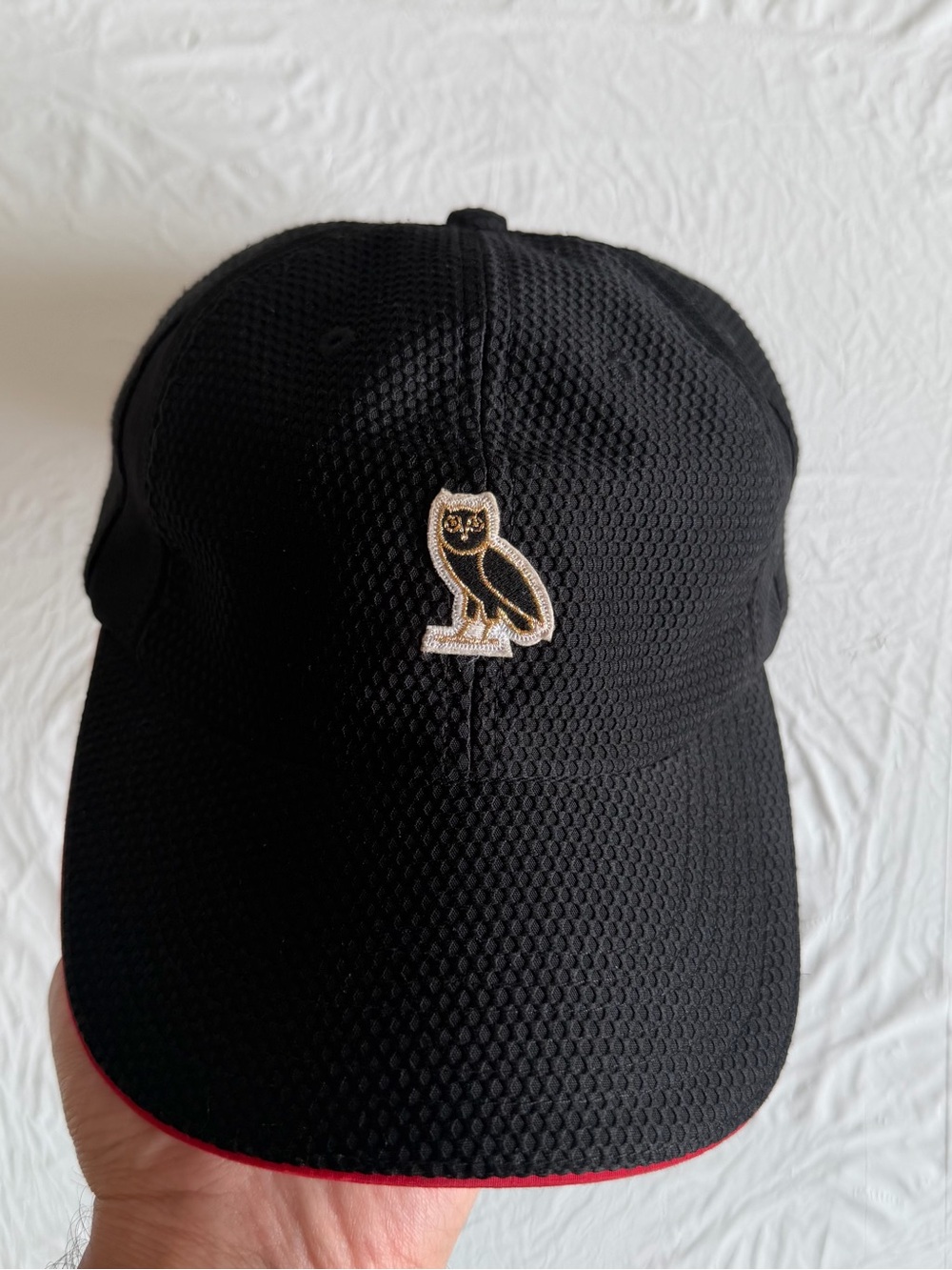 OVO Black Baseball Cap with Gold Owl Patch and Red Trim